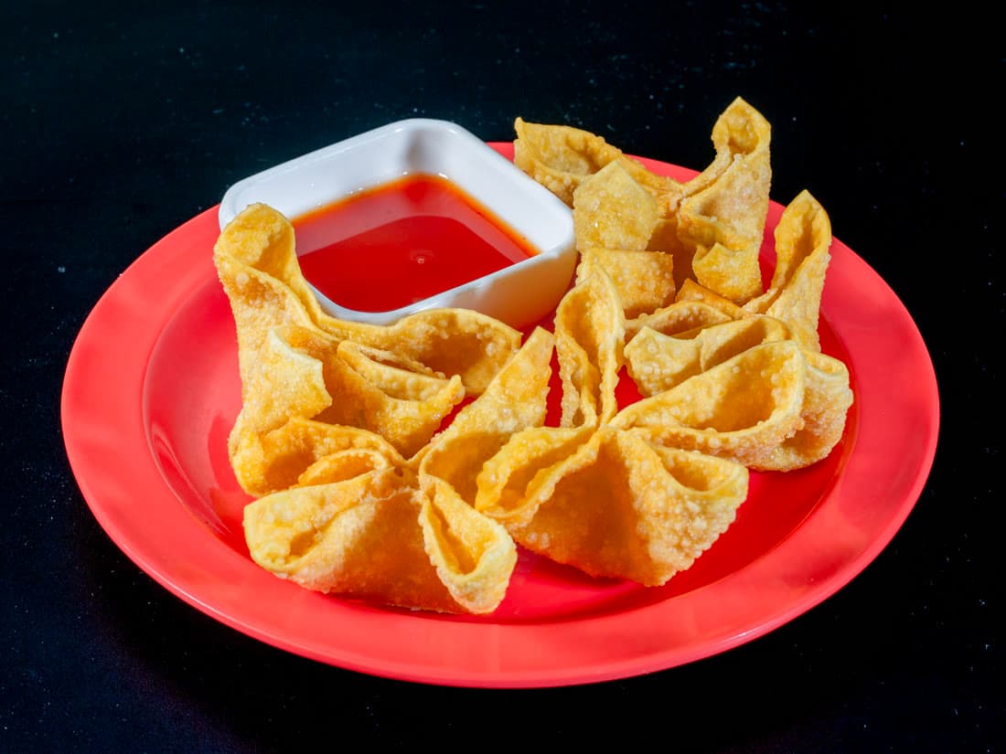 Crab meat rangoon, five to a box, with sweet chili sauce